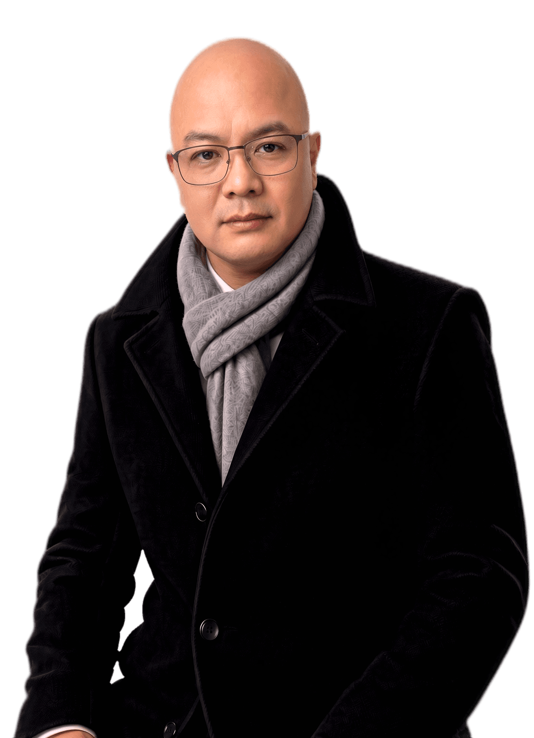 Portrait of Villar David wearing glasses, a grey scarf and a black tailored overcoat